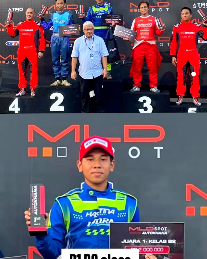 Pembalap tim mengangkat trofi juara 1 kelas B2